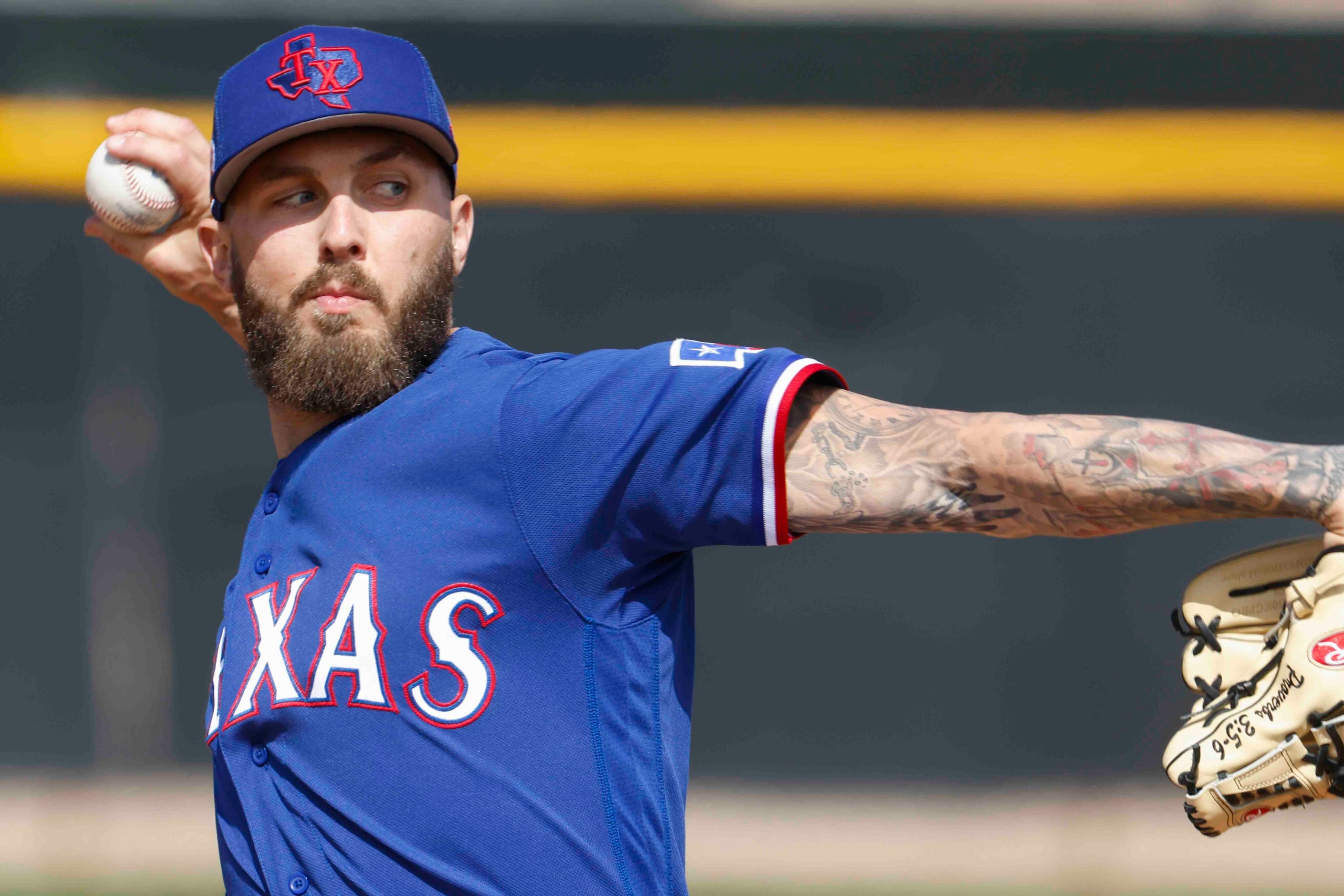 Texas Rangers pitcher Joe Barlow throws a pitch during a spring training workout at the...