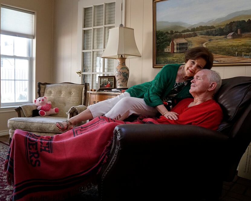 Dianne Bryant sits with her husband, Marc, who suffers from Lewy Body dementia at their home...