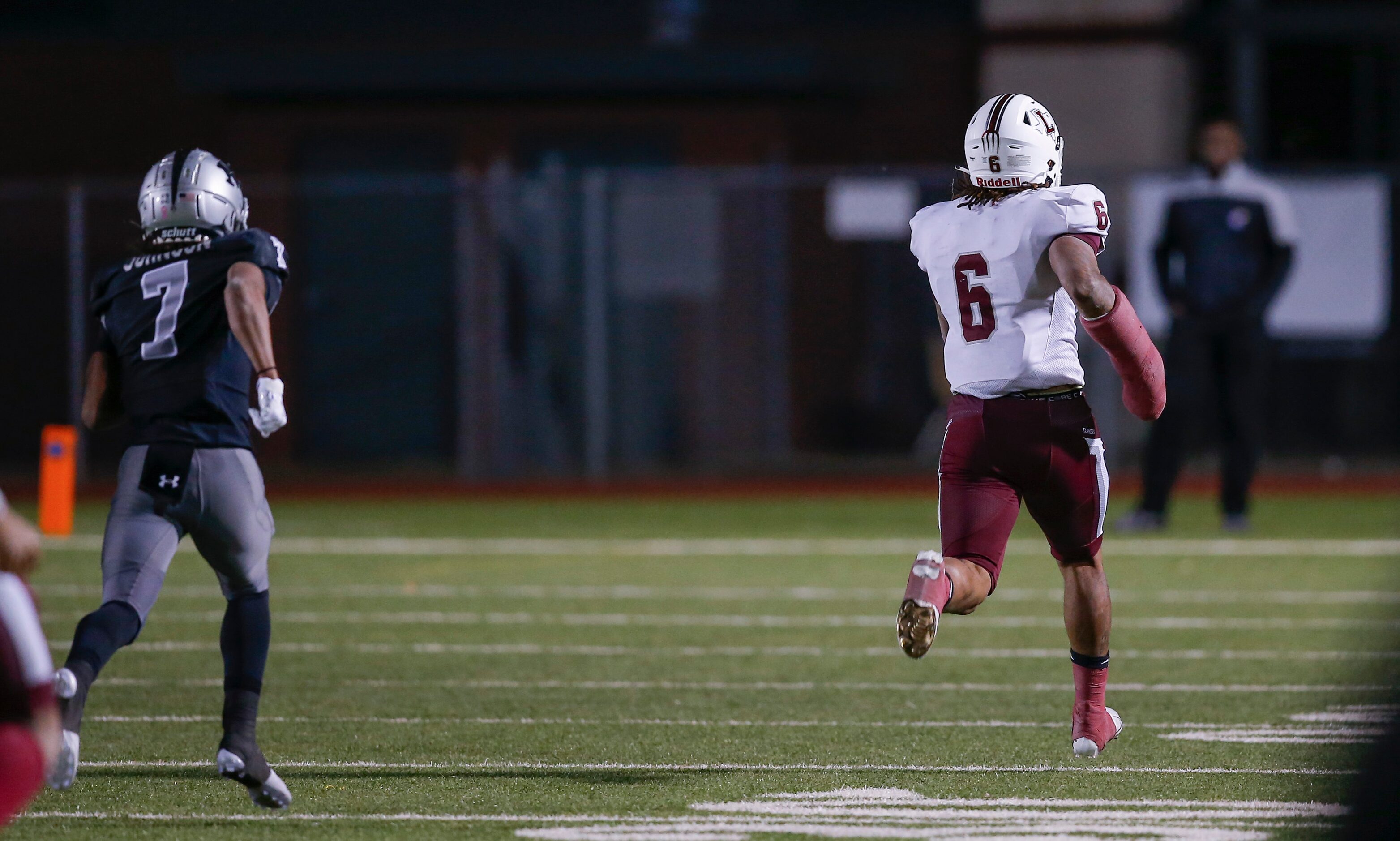 Lewisville senior running back Damien Martinez (6) breaks past Arlington Martin junior...