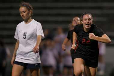 Coppell's Maya Ozymy (22) bolts across the field to congratulate teammate Jocelyn Alonzo...