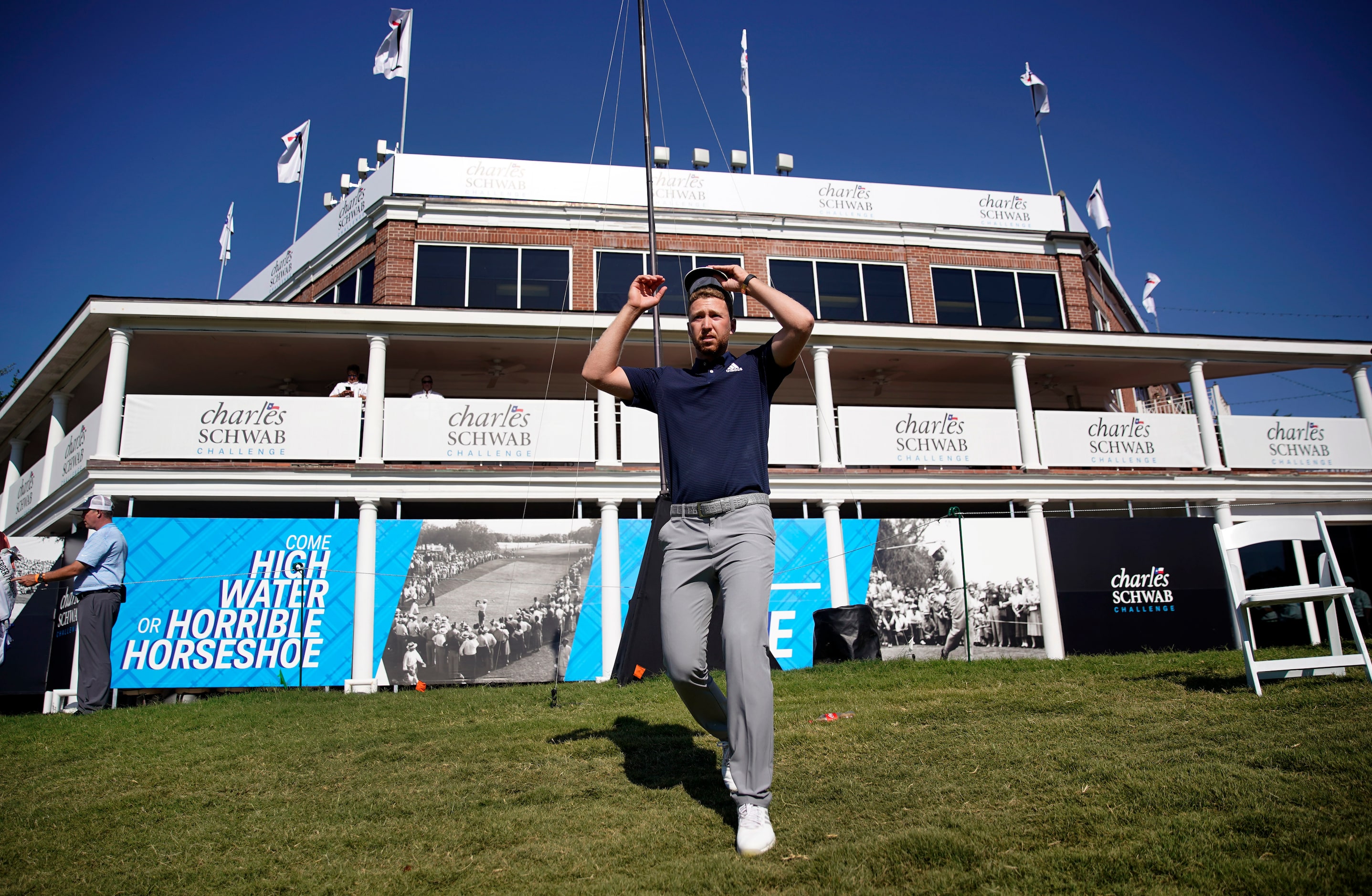 PGA Tour golfer Daniel Berger walks to the 18th green to receive the checkered jacket, check...