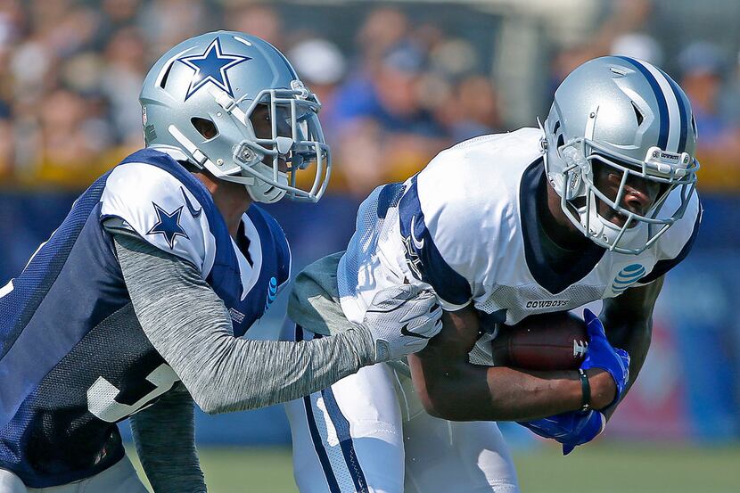 Dallas Cowboys wide receiver Michael Gallup (13) is tackled by cornerback Byron Jones during...