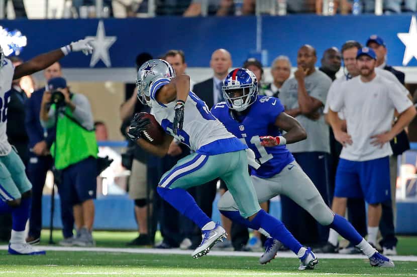 Dallas Cowboys wide receiver Terrance Williams (83) is chased by New York Giants cornerback...