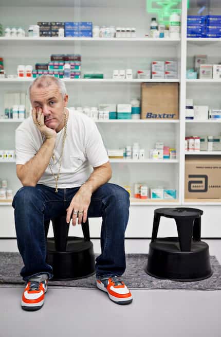 Damien Hirst in 2013 in front of his installation 'Pharmacy' (1992) at the Museum of...
