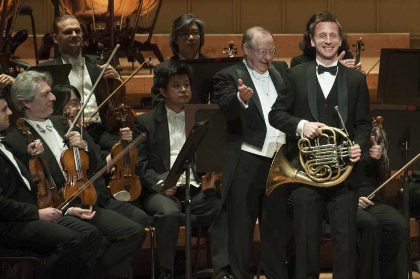 Conductor Nicholas McGegan introduced principal horn David Cooper to the audience at the...