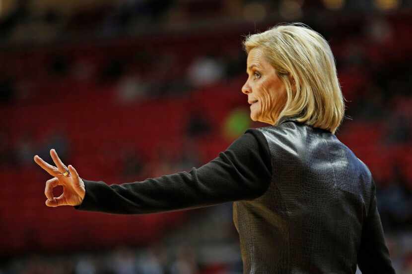 Baylor coach Kim Mulkey celebrates after a her player was fouled during an NCAA basketball...