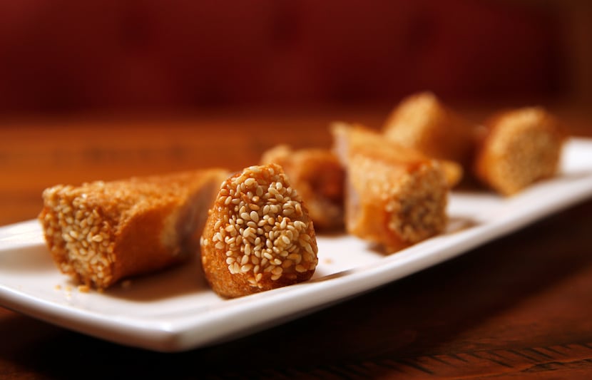 The fried taro toast roll, from the dessert menu, is a little like a cannoli, with a crisp...