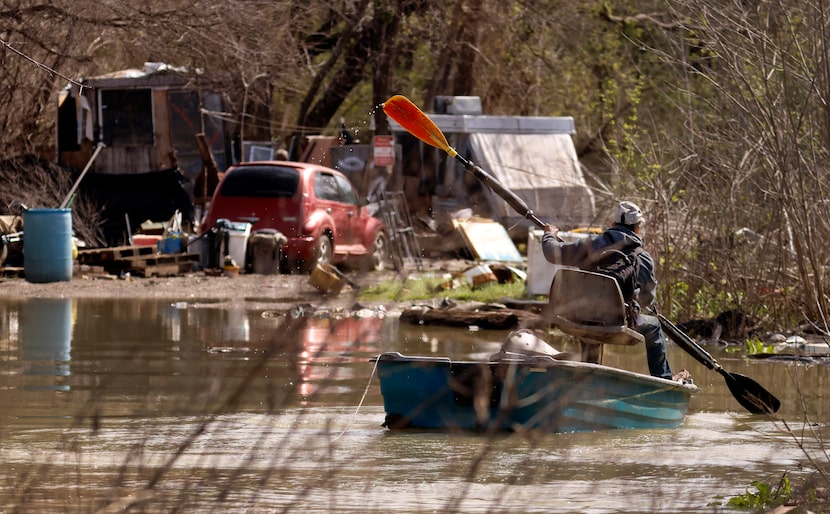 Urbano Zepeda, who lives in another Elm Fork encampment, canoed  over to check on Wendy on...