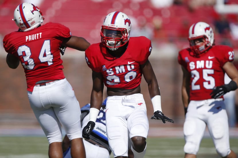 Southern Methodist Mustangs defensive back Shakiel Randolph (28) reacts after hitting...