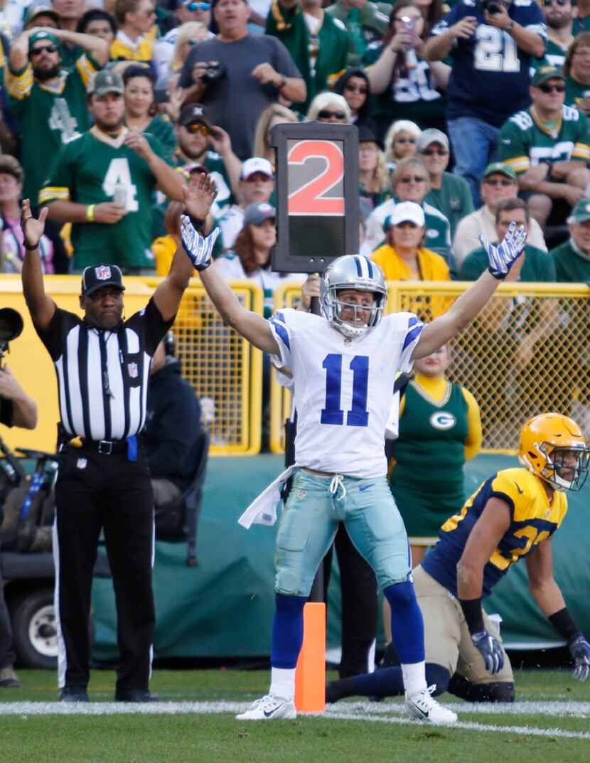 Dallas Cowboys' Cole Beasley celebrates his touchdown catch during the first half of an NFL...