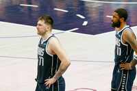 Dallas Mavericks guard Luka Doncic (77) and Dallas Mavericks guard Kyrie Irving (11) are...