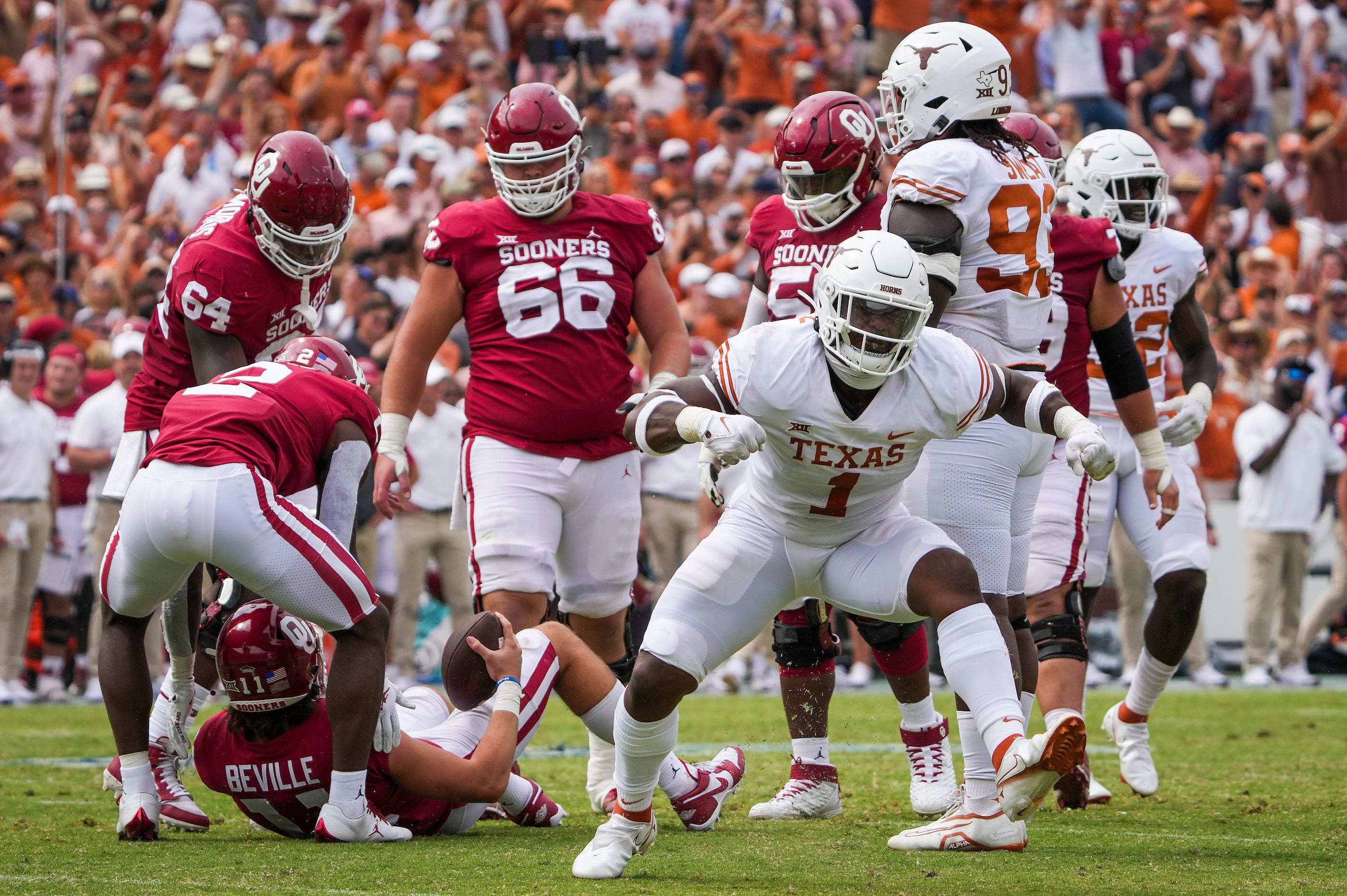 Texas defensive end Justice Finkley (1) celebrates after sacking Oklahoma quarterback Davis...