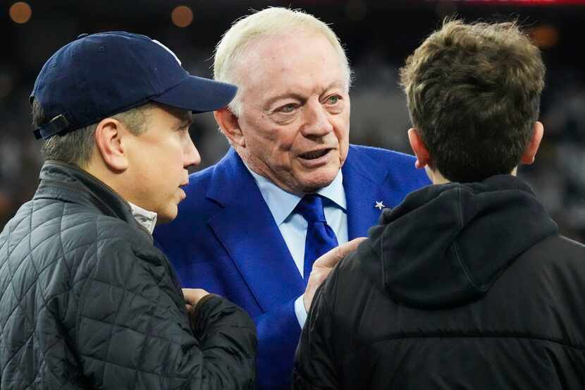 Dallas Cowboys owner and general manager Jerry Jones talks on the sidelines as the teams...