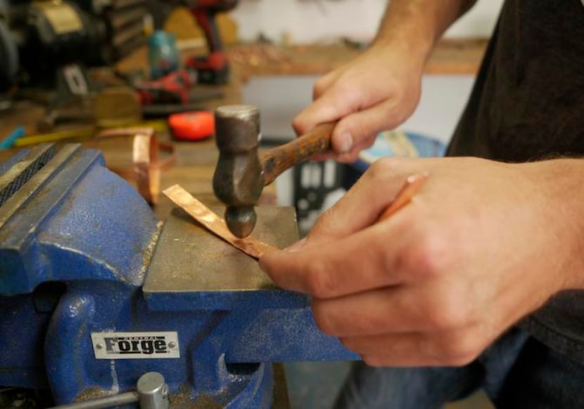 
Wayne flattens copper tubing for a Mason jar planter.
