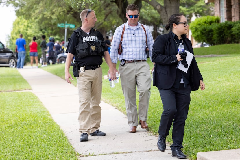 Officers with the Dallas Police Department's special victims unit went door to door in...