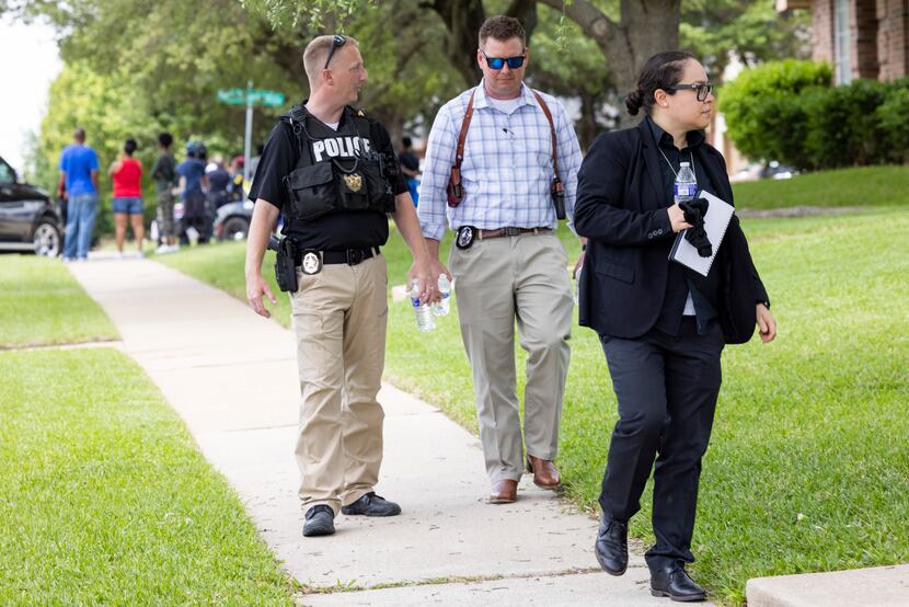 Officers with the Dallas Police Department's special victims unit went door to door in...