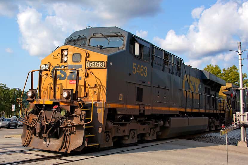 A CSX freight train runs through a crossing in Homestead, Pa., Wednesday, Sept. 14, 2022.
