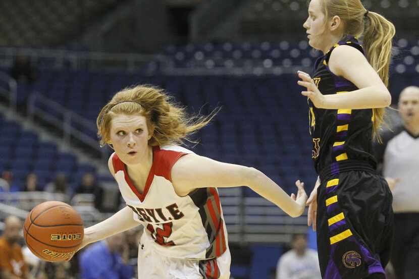 Argyle's Vivian Gray (12) drives around Liberty Hill's Autumn Lange (14) during the UIL...