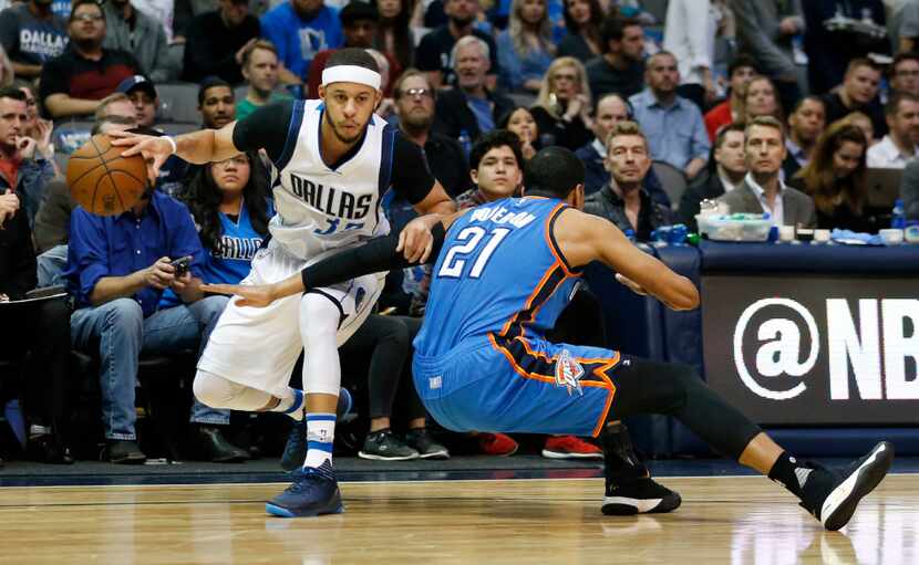 Dallas Mavericks guard Seth Curry (30) is fouled as he attempts to pass by Oklahoma City...