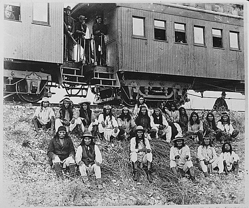 Apaches, en route to their imprisonment in Florida, are shown in this 1886 photo. Geronimo...