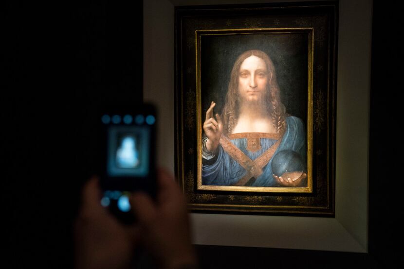 A visitor took a photo of the painting Salvator Mundi by Leonardo da Vinci at Christie's New...