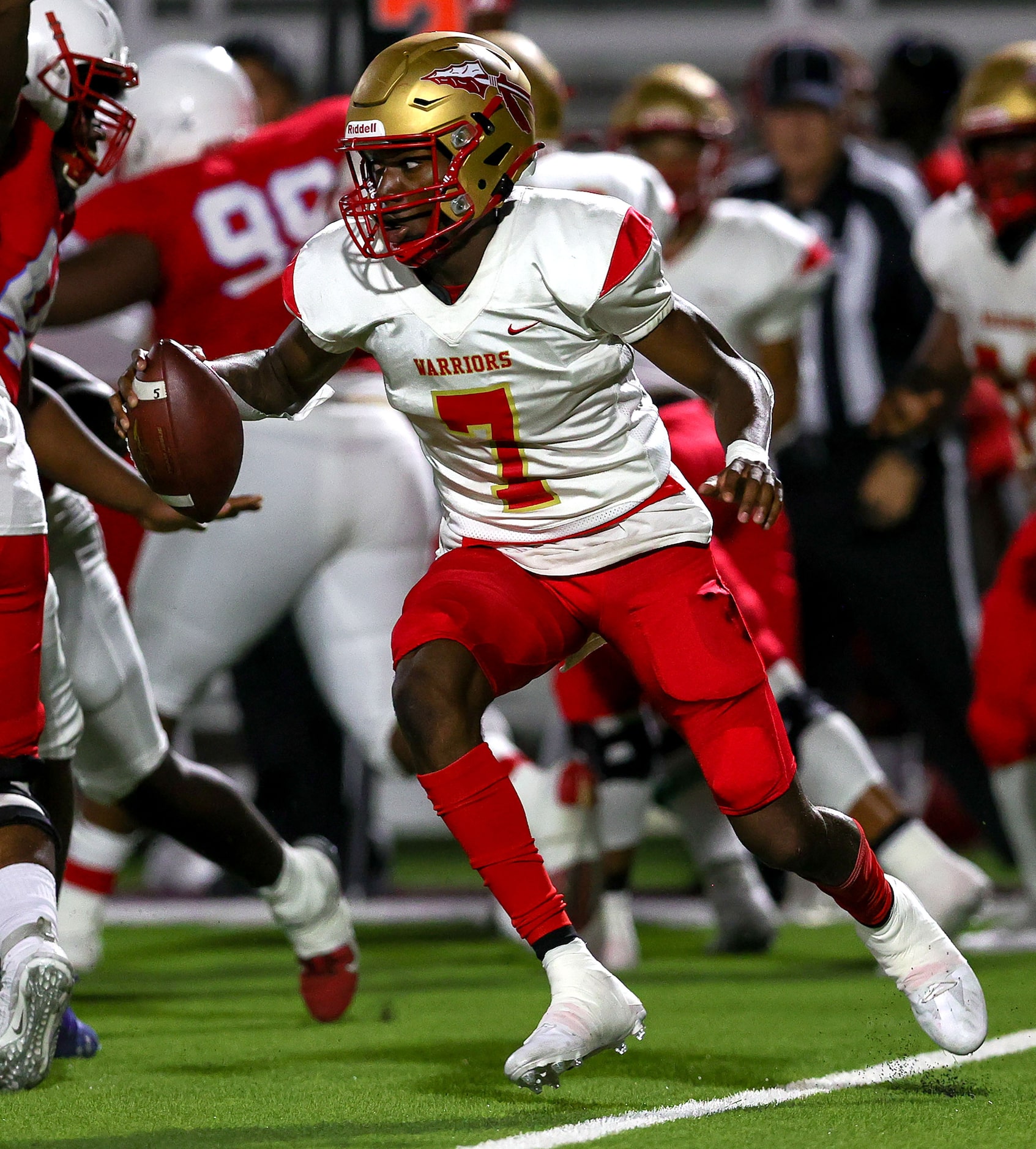 South Grand Prairie quarterback Michael Stallworth (7) looks for some running room against...