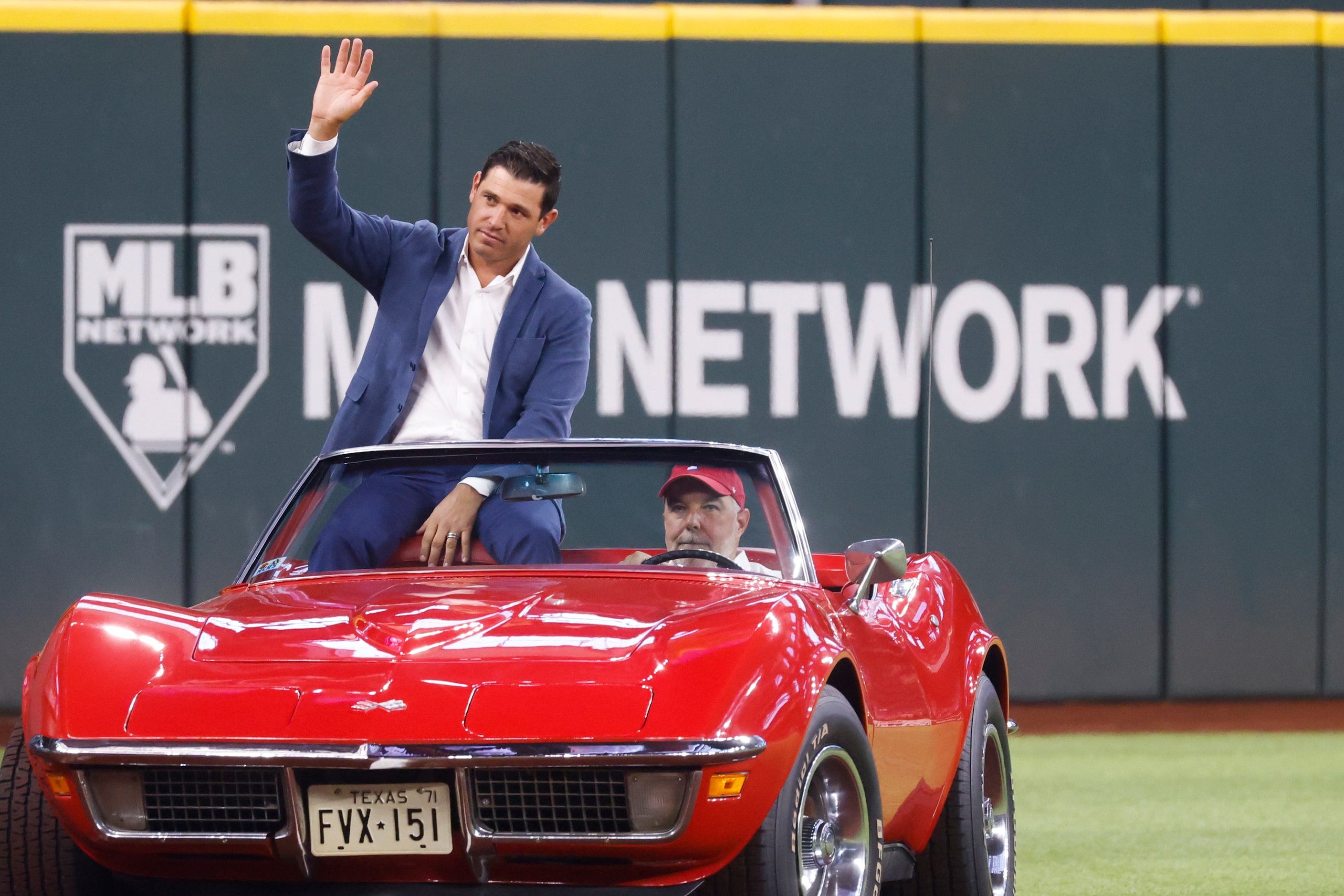 Former Texas Ranger Ian Kinsler waves as he arrives at the induction ceremony at Globe Life...