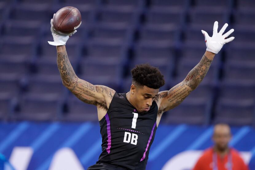 Louisville defensive back Jaire Alexander runs a drill at the NFL football scouting combine...