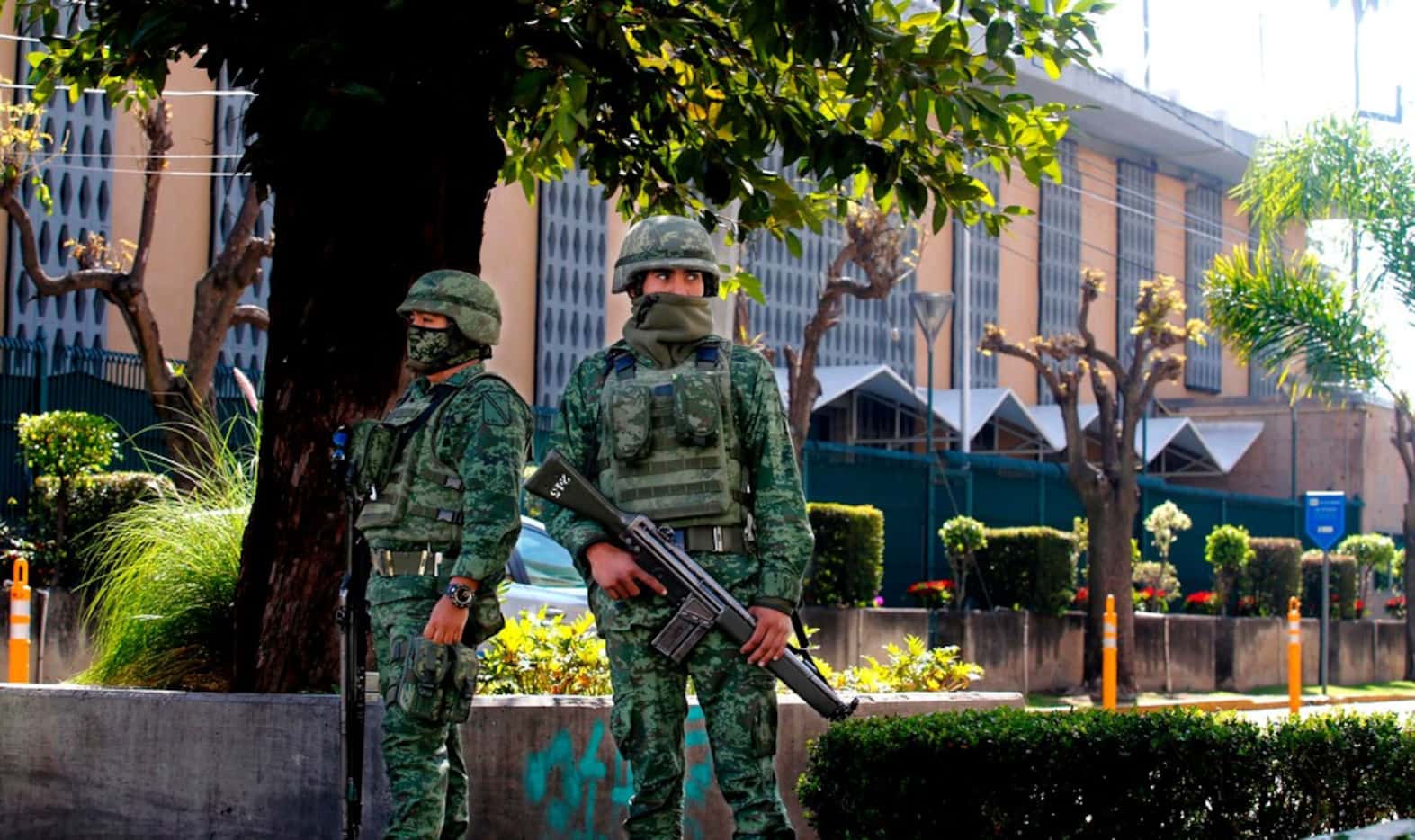 Members of the Mexican Army stand guard outside the U.S. Consulate in Guadalajara, Mexico on...