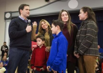  Republican presidential candidate, Sen. Marco Rubio, R-Fla., left, is joined by his wife...