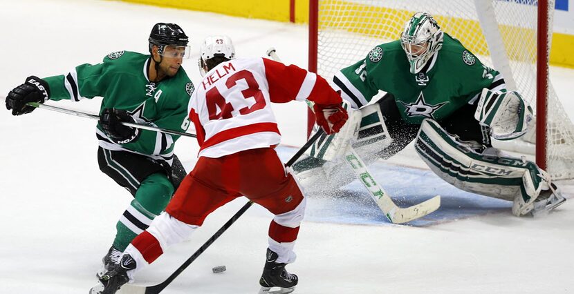 Dallas Stars defenseman Trevor Daley (6) breaks up a shot attempt by Detroit Red Wings...