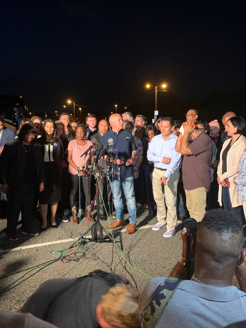 Rep. Chris Turner, (center) D-Grand Prairie, gets ready to speak at a press conference by...