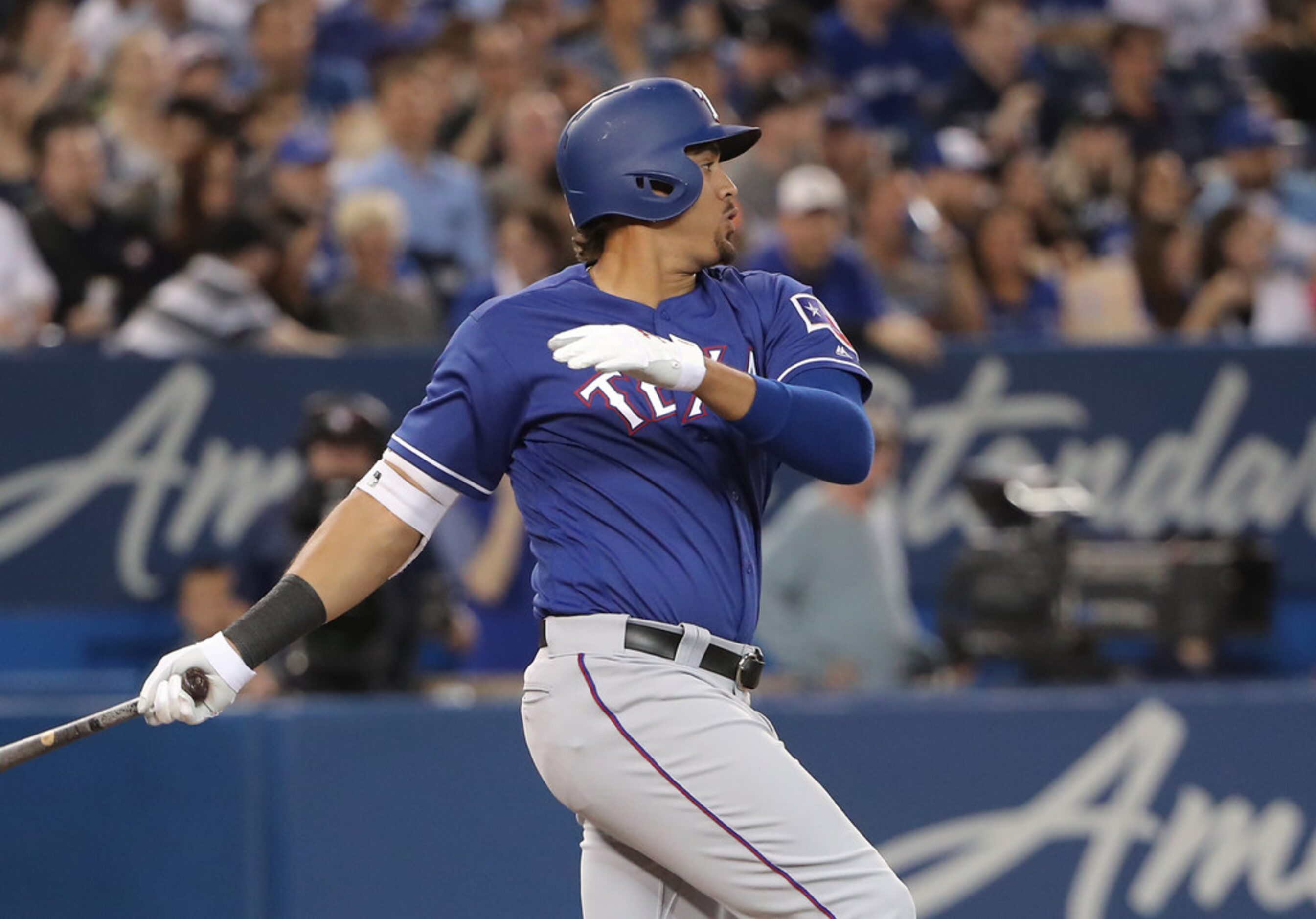 TORONTO, ON - APRIL 27: Ronald Guzman #67 of the Texas Rangers hits a two-run single in the...