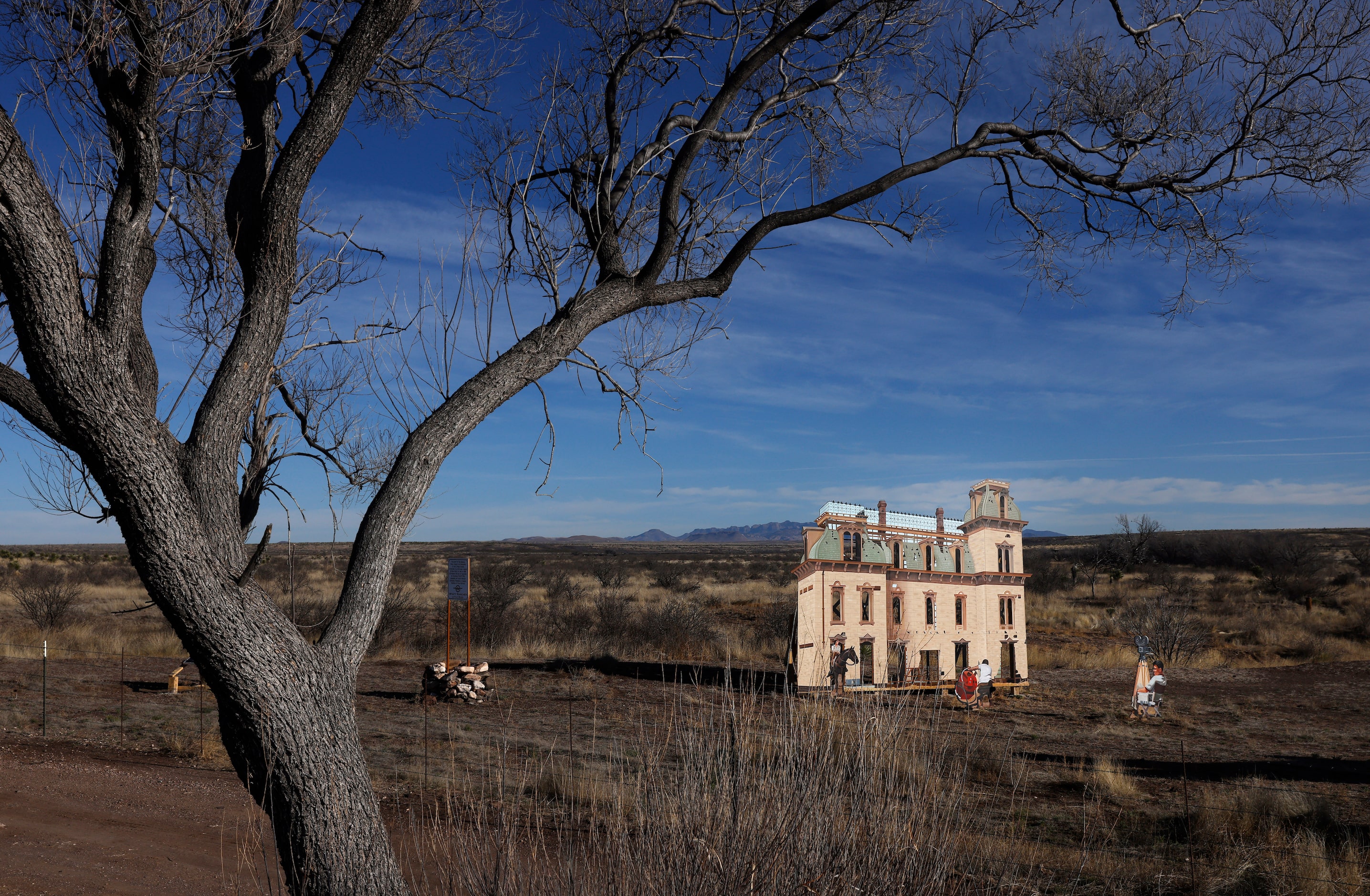 A larger-than-life, standing mural of the movie set is part of the Giant Marfa Mural seen...