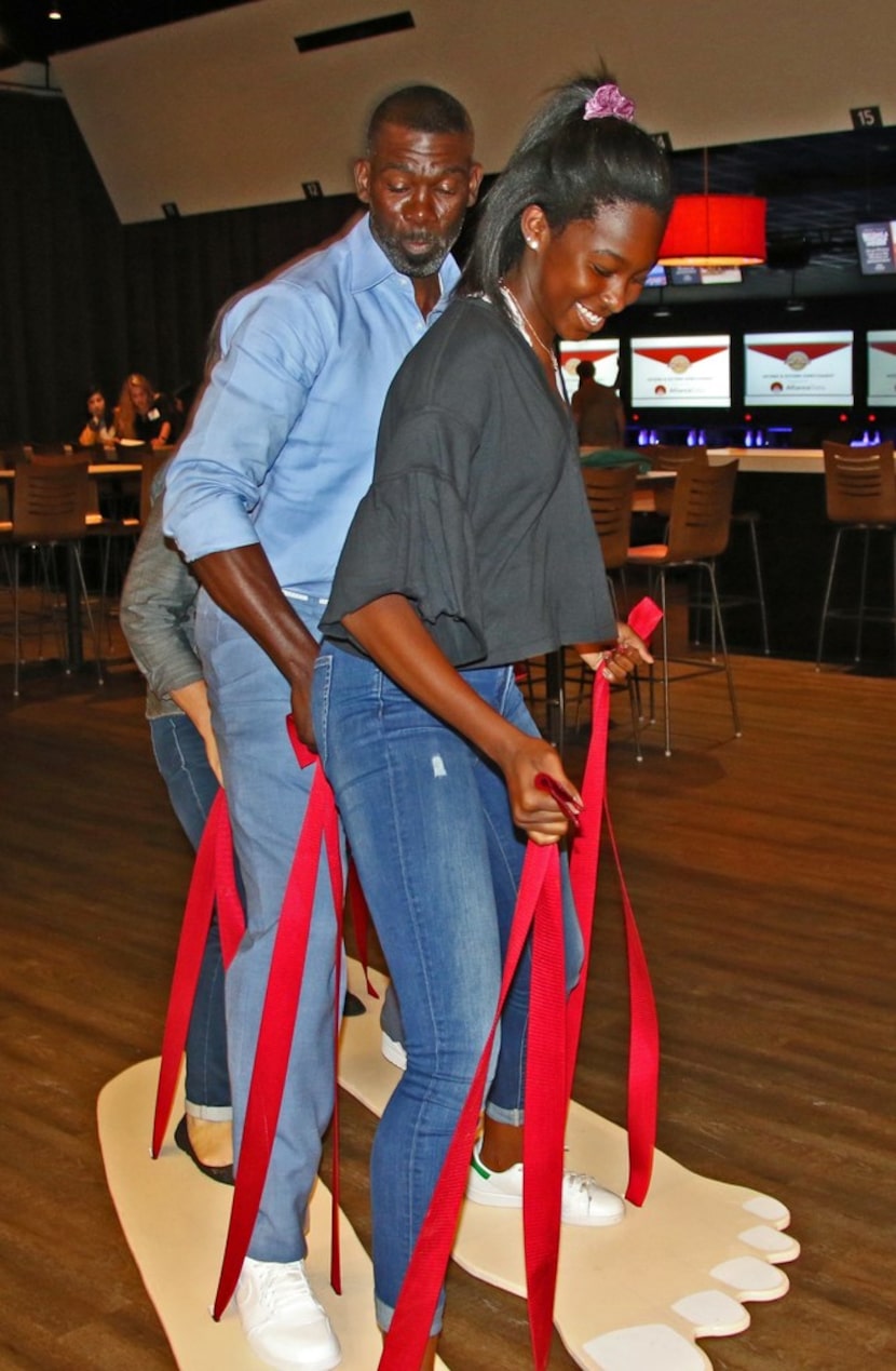 Michael Finley and his daughter, Micah, work together during a fun event at the 5th annual...