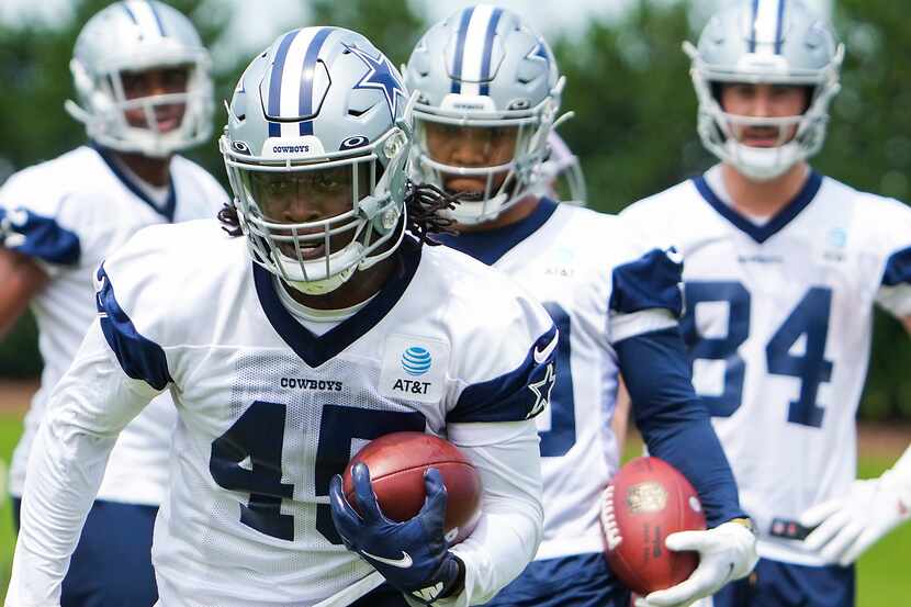 Dallas Cowboys fullback Sewo Olonilua (45) runs a drill during a minicamp practice at The...