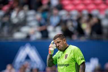 Real Salt Lake goalkeeper Nick Rimando wipes his eye during second-half MLS soccer action...