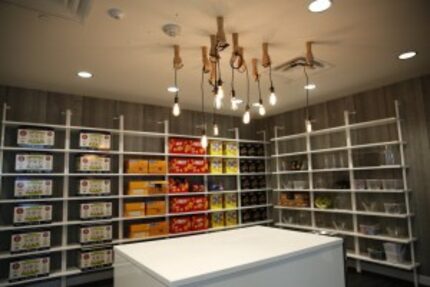  A pantry filled with snacks has whimsical lighting at rewardStyle's new office in The...