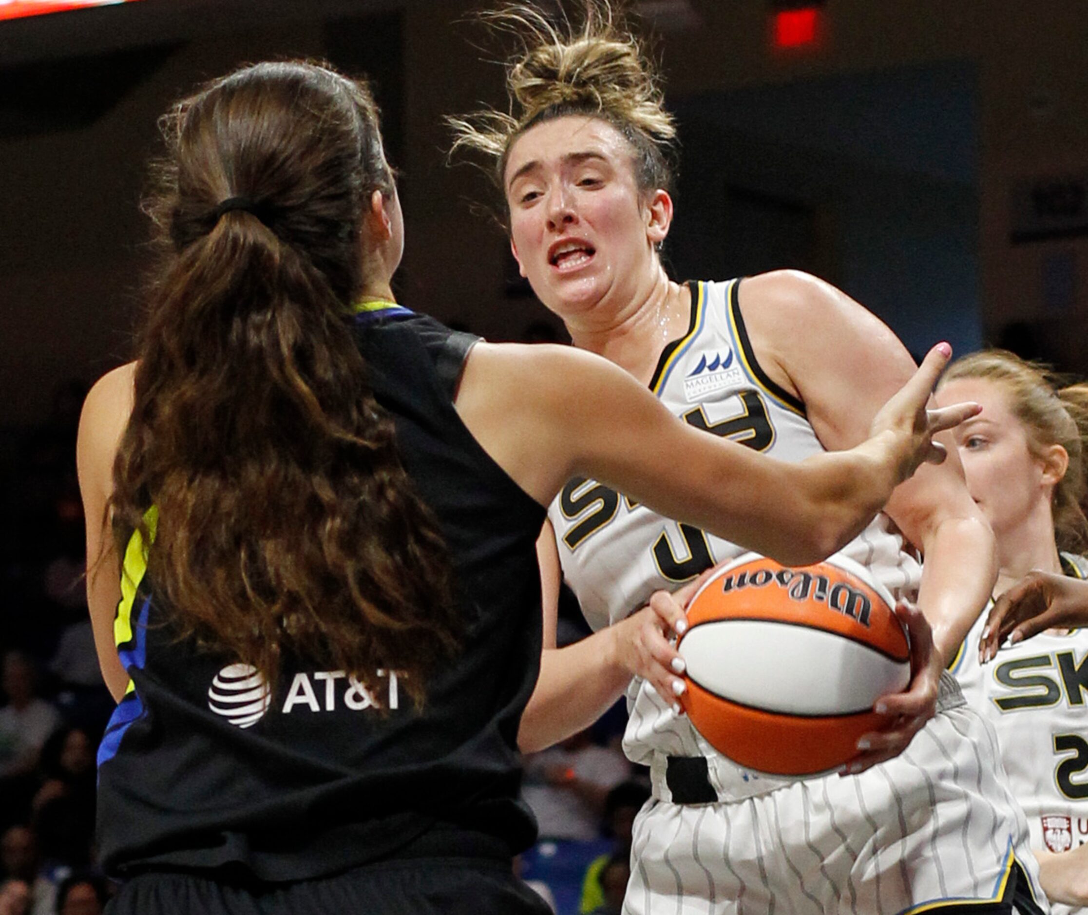 Chicago Sky guard Marina Mabry (4) comes down with a rebound in front of Dallas Wings...