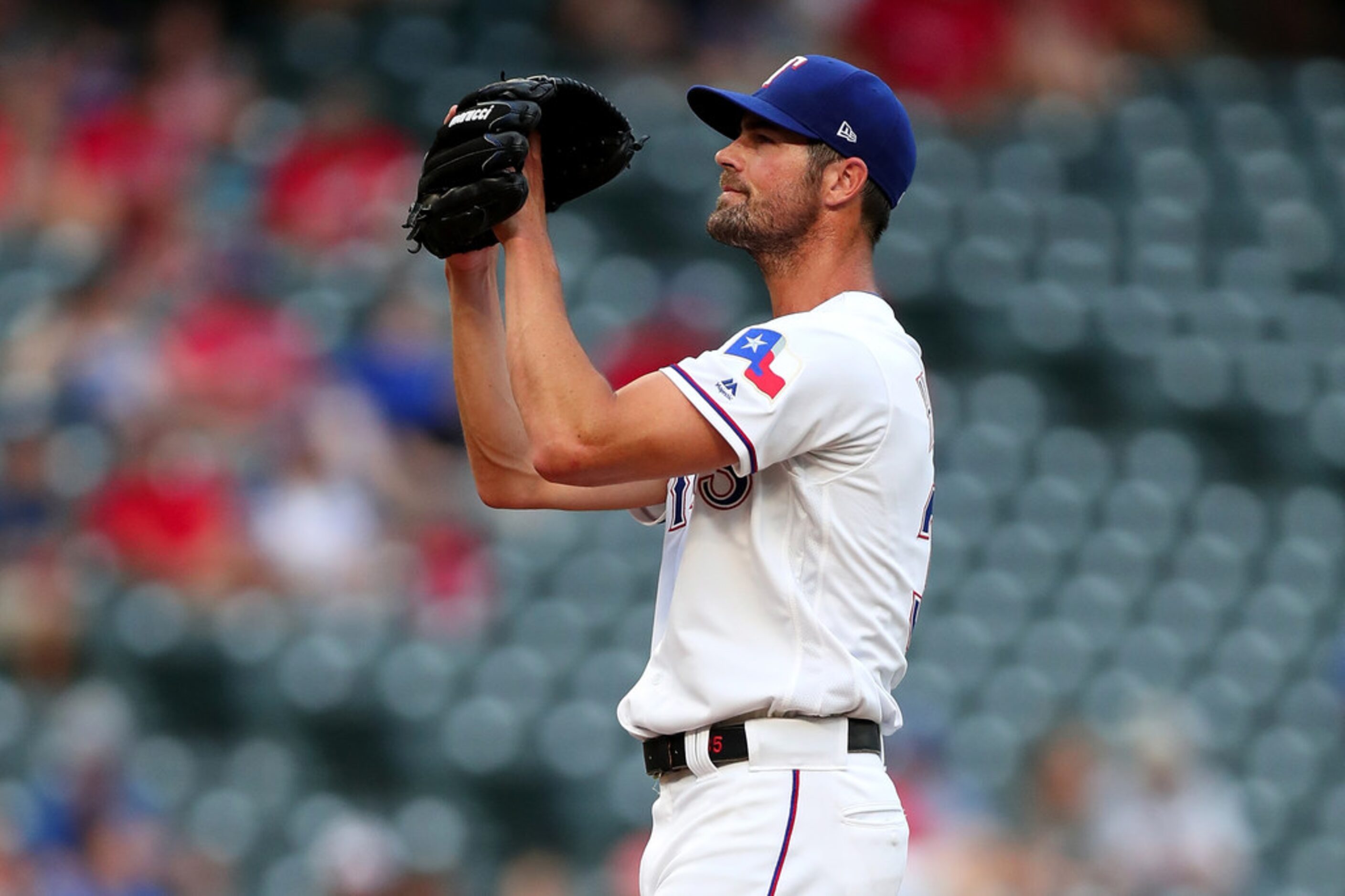 ARLINGTON, TX - JULY 23:  Cole Hamels #35 of the Texas Rangers pitches against the Oakland...