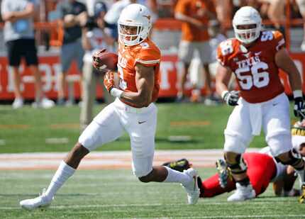 FILE - Texas wide receiver Collin Johnson (9) runs after a catch during a game against...