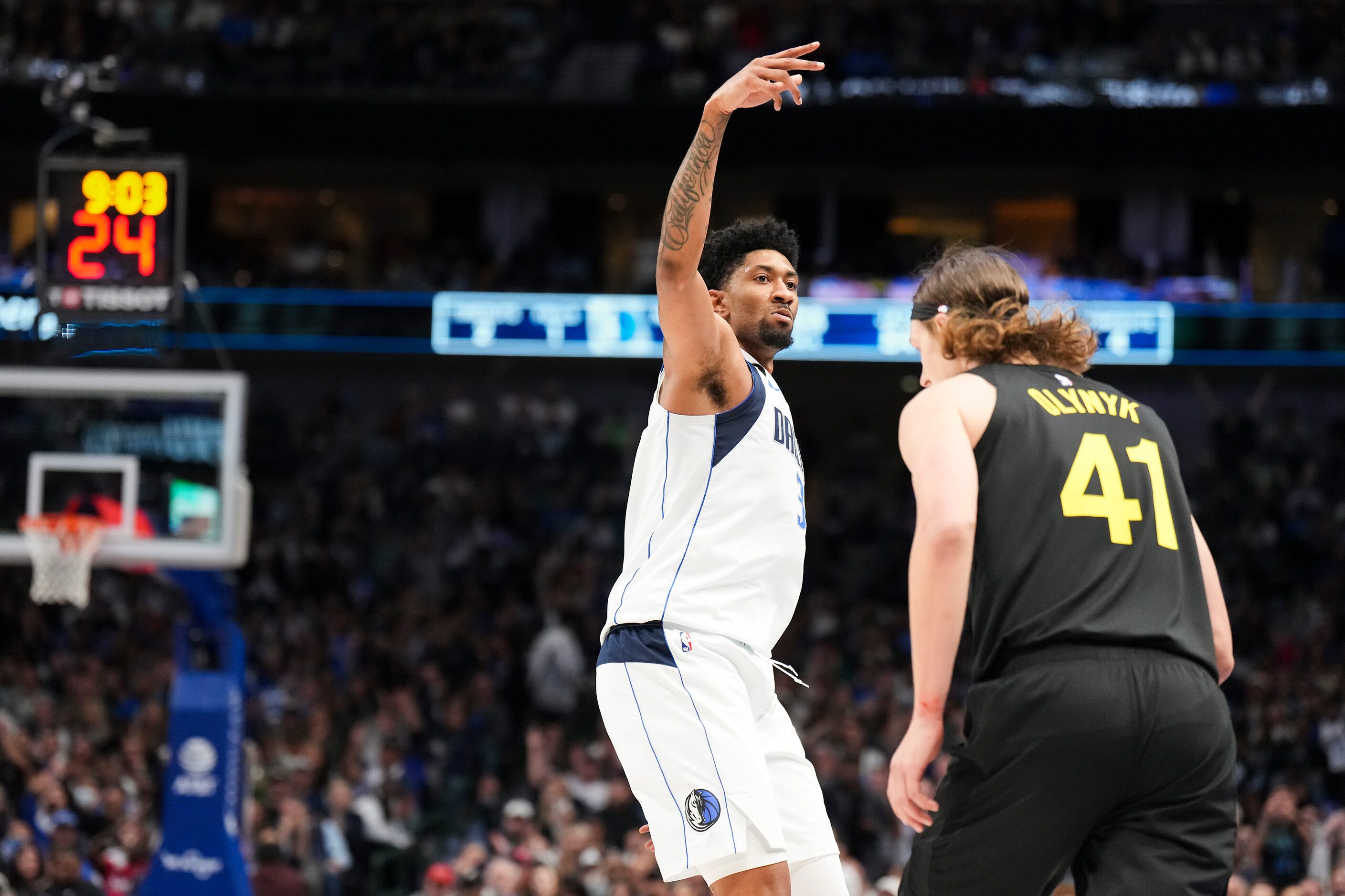 Dallas Mavericks center Christian Wood (35) celebrates after hitting a 3-pointer past Utah...