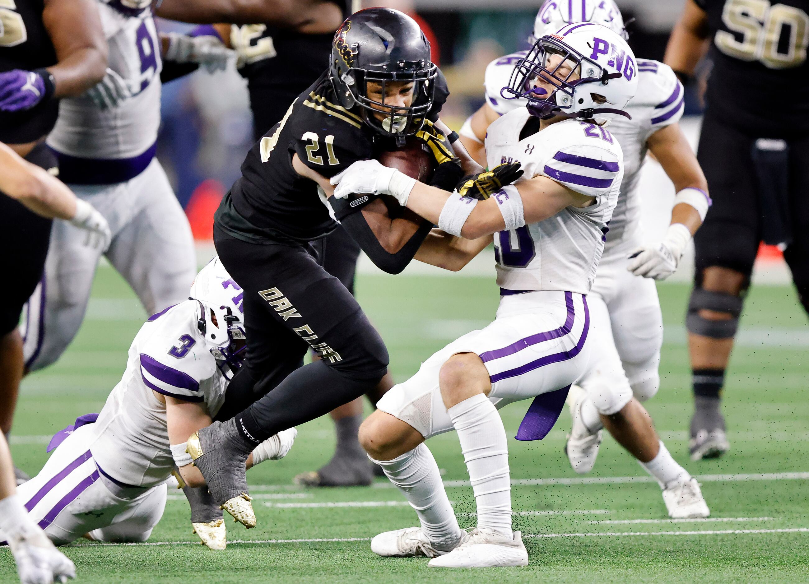 South Oak Cliff running back Danny Green (21) powers ahead for more yards as Port...