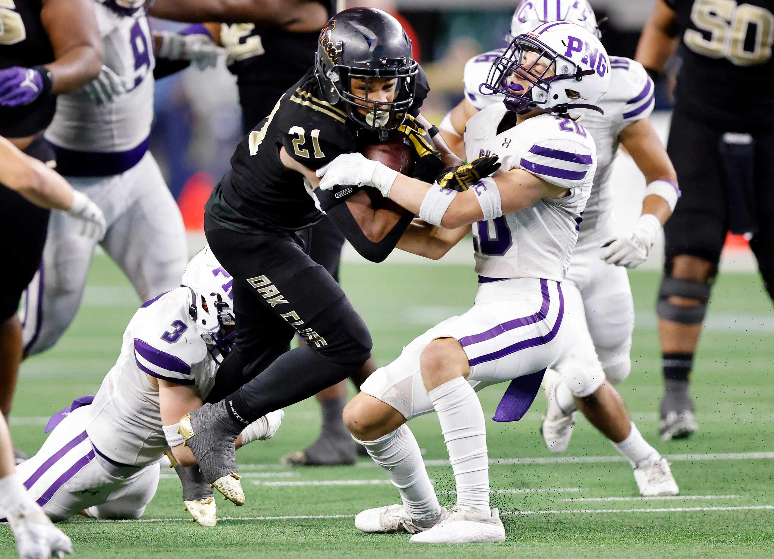 South Oak Cliff running back Danny Green (21) powers ahead for more yards as Port...