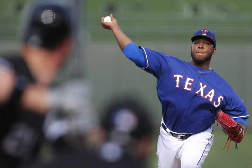 Texas pitcher Neftali Feliz throws a sixth-inning pitch during the Chicago White Sox vs. the...