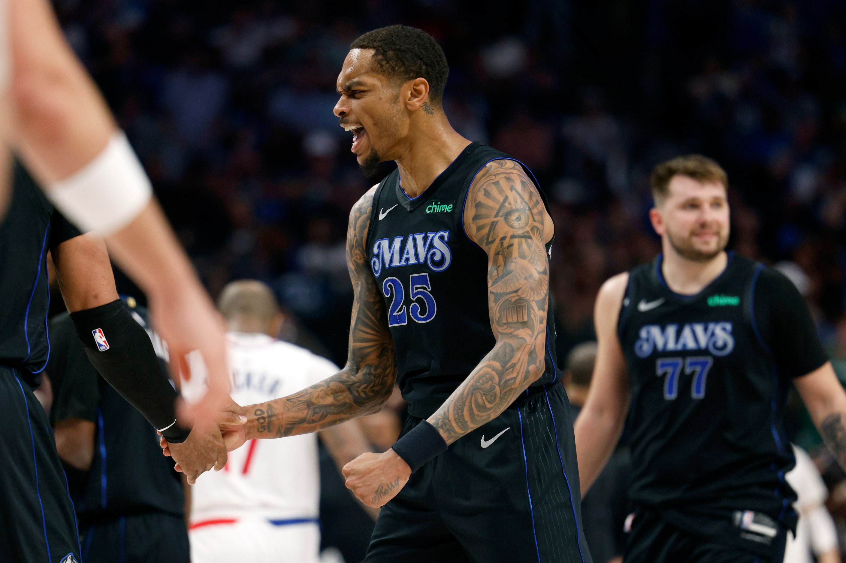 Dallas Mavericks forward P.J. Washington (25) reacts after a timeout during the second half...