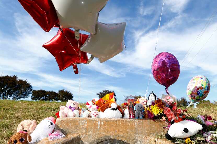 A memorial in the area where the body of a small child was found Sunday morning during the...