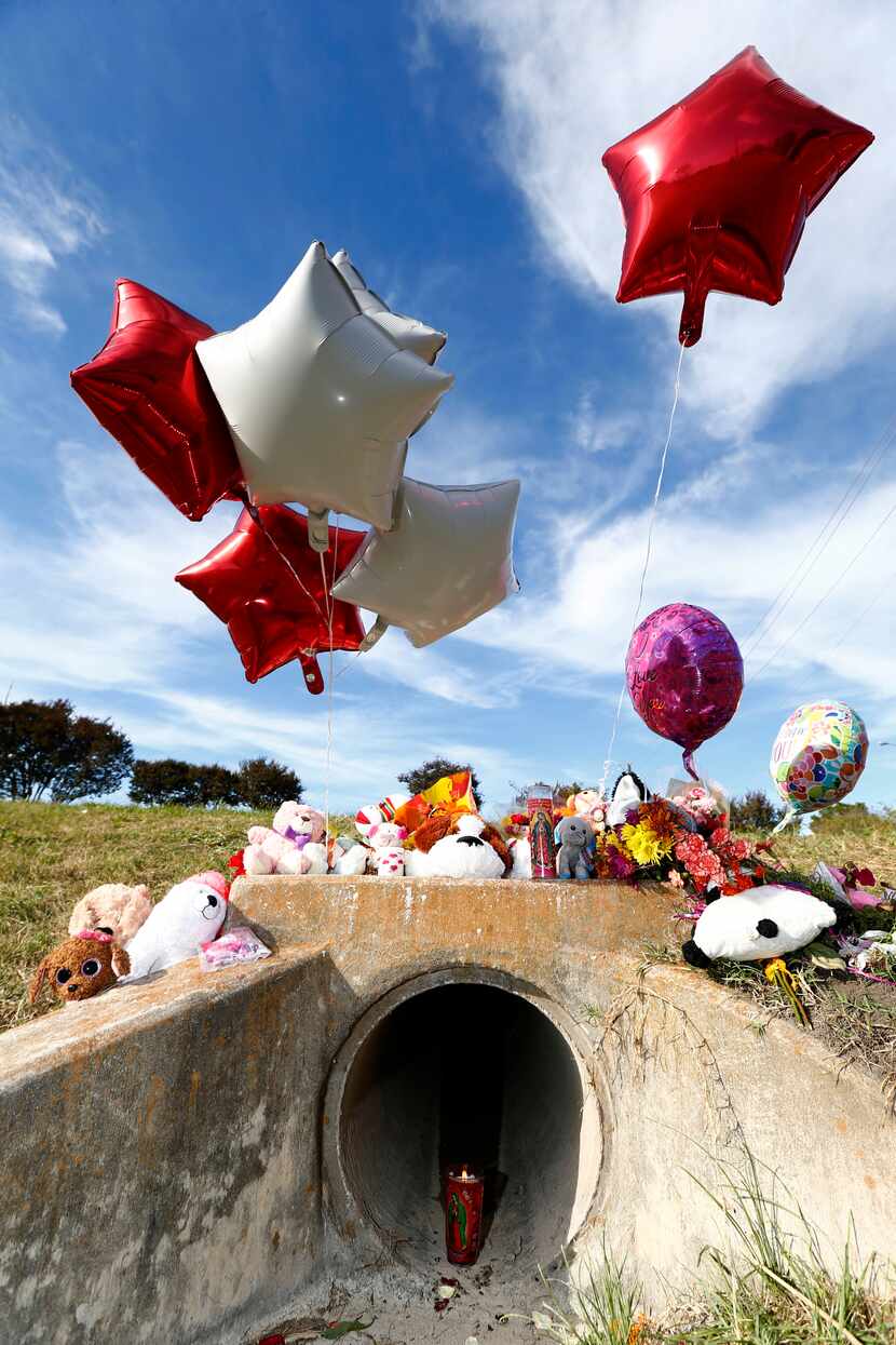 A memorial in the area where the body of a small child was found Sunday morning during the...