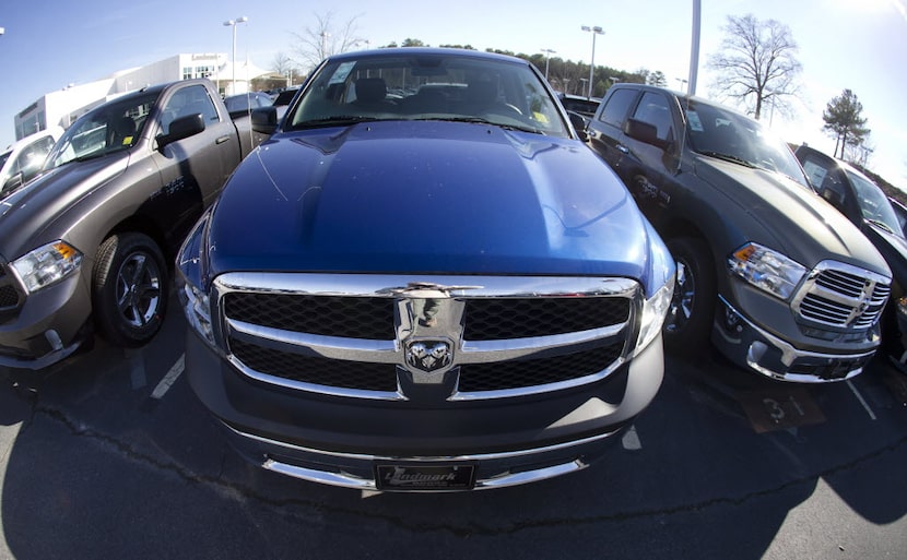 Dodge Ram pickup trucks on a lot in Morrow, Ga. (AP Photo/John Bazemore) 