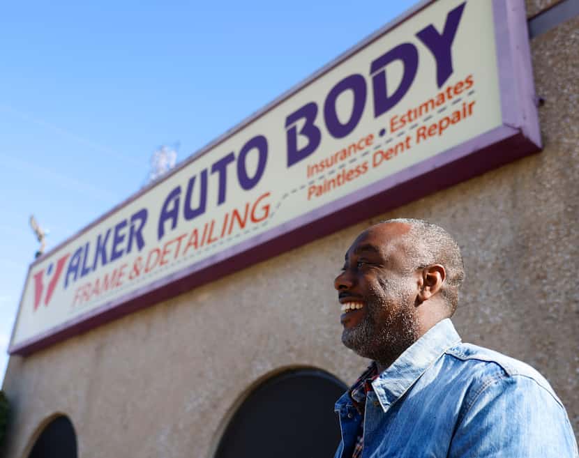 Walker Auto Body & Frame Shop owner Mark Walker Jr. shares a laugh as he gives a tour of the...